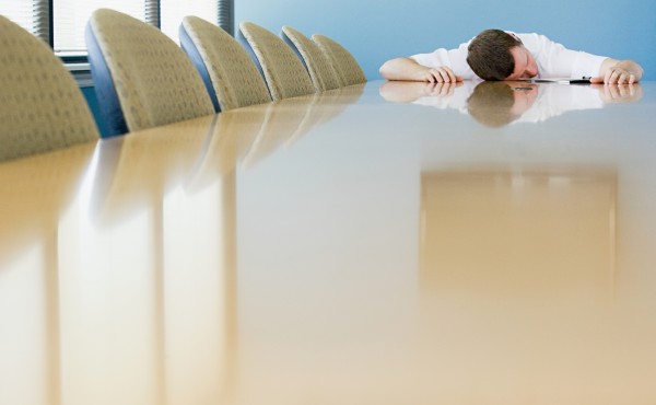 Man sleeping on conference table