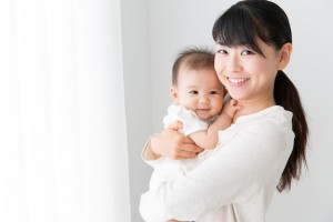 asian baby and mother relaxing