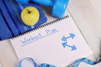 Workout plan,dumbbell, tawel and apple. Woman, fittness, sport concept background