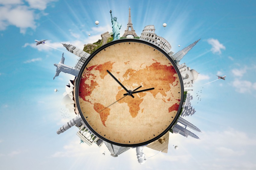 Famous monuments of the world surrounding a clock with sky background