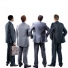 four business mans from the back - looking at something over a white background